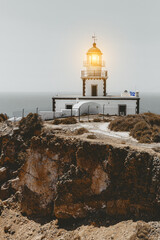 Old lighthouse on the sea shore.