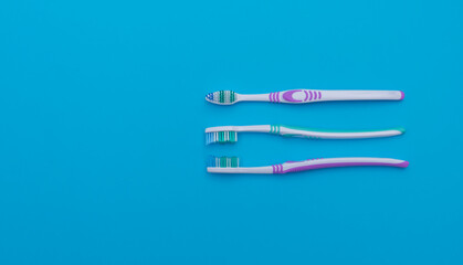 toothbrushes for oral hygiene on a light blue background
