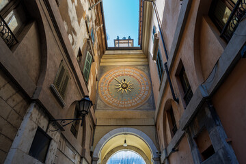 Brescia downtown. Bell and clock tower in Renaissance style, 1540-1550, in Loggia town square (Piazza della Loggia). Lombardy, Italy, Europe. Bronze bell and two statues with hammer (automata).