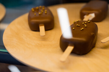 ice creams in chocolate on the counter