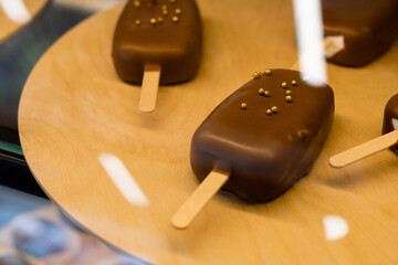 ice creams in chocolate on the counter