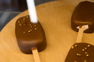 ice creams in chocolate on the counter