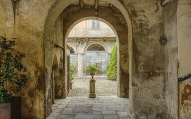 Passageway to the courtyard of an old house in Varese, Italy.