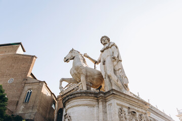 Obraz premium antique statue of a man with a horse. Roman stone statue of a man with a horse.