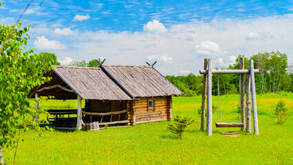 Imitation of a Ukrainian farm. A recreation center in the style of a farmstead with a pond, houses,...