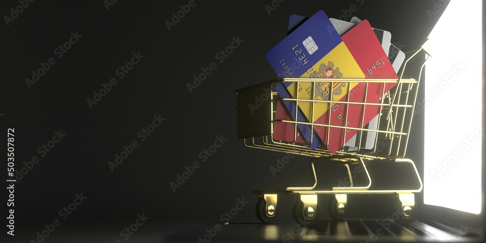 Aufkleber bank card mockups with flags of andorra in a small shopping cart on the laptop. 3d rendering