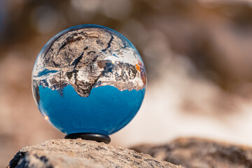 Crystal ball alpine winter landscape shot at the famous Rofan summit, Maurach, Achensee lake, Tyrol, Austria