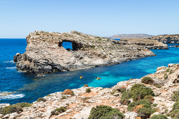 Tourists kayaking into the Blue Lagoon