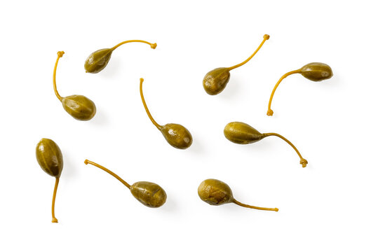 Set of pickled caper berries isolated on white background. Cutout of marinated caper fruit variety. Marinated caperberry for condiment and garnish concepts. Mediterranean cuisine ingredient.