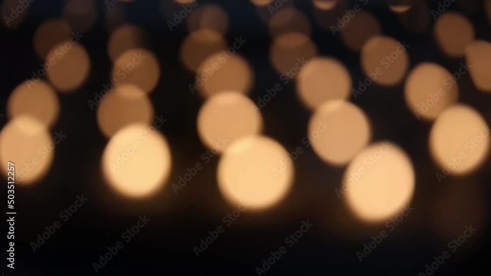 Aufkleber view of bokeh lights of multiple candles in a dark environment