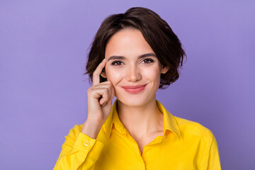 Photo of hr young bob hairdo lady index head wear yellow blouse isolated on violet color background