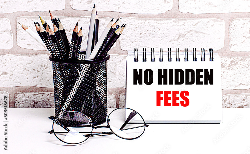 Aufkleber a workplace in the house with glasses, pencils in a stand and a notebook with text no hidden fees on