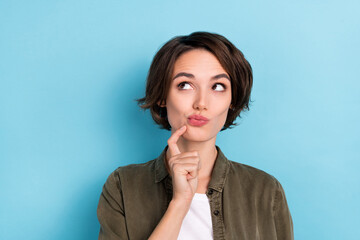 Photo of lovely millennial bob hairdo lady look promo wear khaki shirt isolated on blue color...