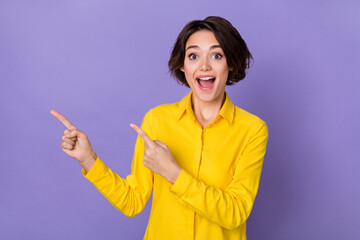 Photo of impressed millennial bob hairdo lady index promo wear yellow shirt isolated on violet...