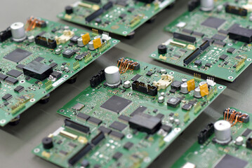 production of microelectronics in a modern industrial factory - motherboard with components in...