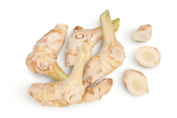 Fresh galangal root with slices isolated on white background with clipping path and full depth of field. Top view. Flat lay