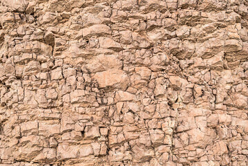 Mountain cracked earth wall background. texture, nature