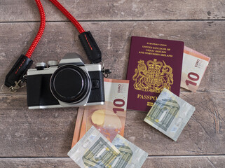 Vacation to Europe concept with camera, money and passport