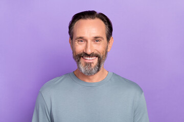 Fototapeta premium Photo of handsome cheerful mature man visit stomatology specialist whitening teeth isolated on purple color background