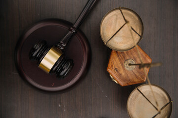 Justice and law concept.Male judge in a courtroom with the gavel, working with, computer and...