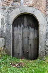 Fototapeta na wymiar an old wooden door to the basement of a church