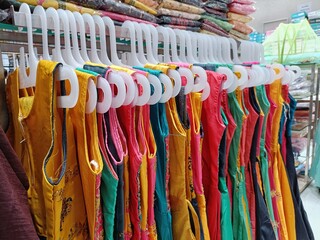 colorful women's clothes on hangers
