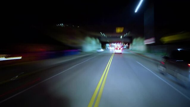 Hyperlapse from a car at night. POV. Hollywood, Los Angeles, United States. Perfect to represent concepts as autonomous driving, futuristic cityscape, city life, etc. 