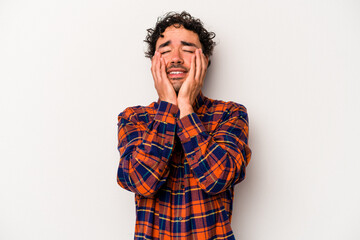 Fototapeta na wymiar Young caucasian man isolated on white background whining and crying disconsolately.