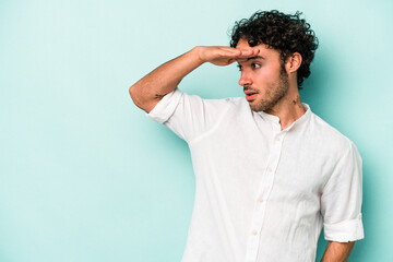 Young caucasian man isolated on white background looking far away keeping hand on forehead.