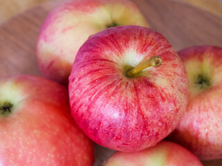 Fototapeta na wymiar A few ripe striped apples, a close-up shot. Apples of the gala and Ligol varieties.