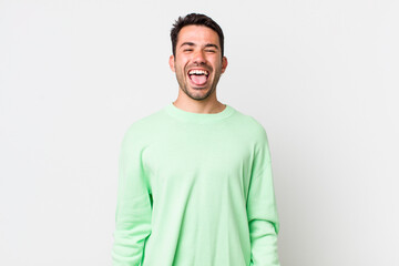 young handsome hicpanic man with cheerful, carefree, rebellious attitude, joking and sticking...