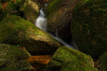 Cerveny creek with Cerveny waterfall in Jizerske mountains in spring morning