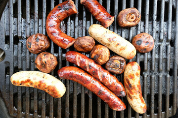 barbecue with poilsh sausages and mushrooms