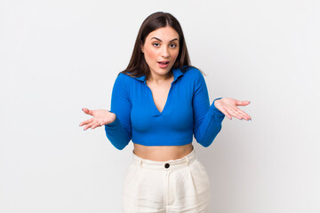 young pretty woman open-mouthed and amazed, shocked and astonished with an unbelievable surprise
