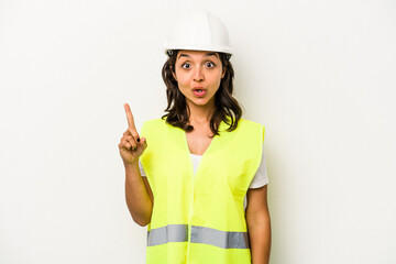 Young laborer hispanic woman isolated on white background having some great idea, concept of creativity.