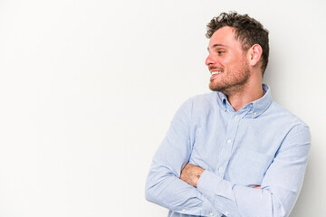 Young caucasian man isolated on white background smiling confident with crossed arms.