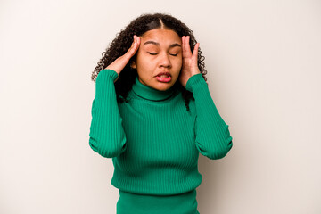 Young African American woman isolated on white background touching temples and having headache.