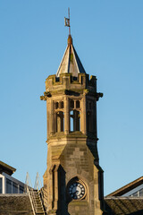 Obraz premium Architectural detail of the clock tower on the roof of the Carlisle Train Station. Also known as the Carlisle Citadel this building is Grade ll listed. Carlisle, Cumbria, UK.