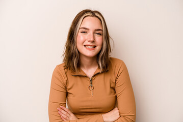 Fototapeta premium Young caucasian woman isolated on white background laughing and having fun.