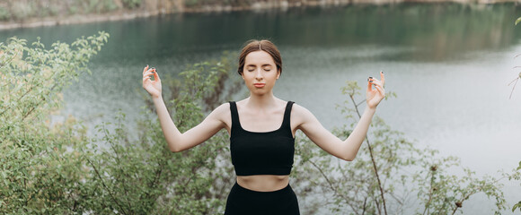 Fototapeta na wymiar Lifestyle woman yoga exercise and pose for healthy life. Young girl pose balance body vital zen meditation for workout nature mountain background in morning sunrise.