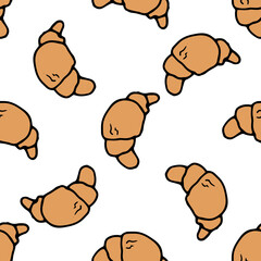 a croissant pattern. a seamless pattern of a brown croissant drawn in doodle style, often located on a white background for a design template