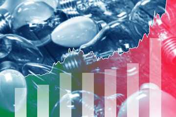 Light bulbs and rising chart representing current electricity price during energy crisis in the world