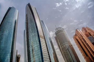 Gordijnen The Skyscrapers of the Emirates Towers in Abu Dhabi, United Arab Emirates © Christian Schmidt 