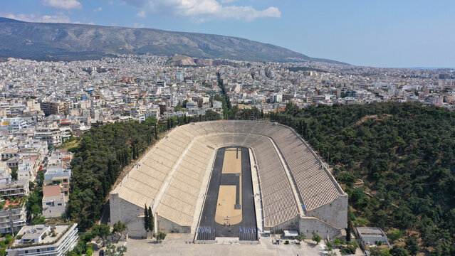 Aerial drone photo of iconic ancient Panathenaic stadium or Kalimarmaro birthplace of the original Olympic games, Athens historic centre, Attica, Greece - Powered by Adobe