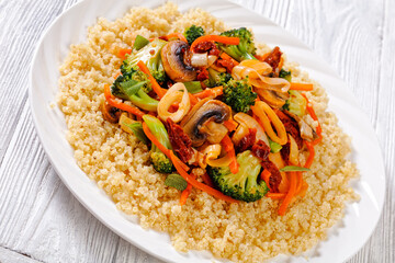 quinoa with fried veggies, mushrooms on plate