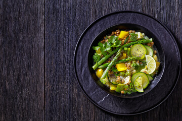 alkaline green soup in black bowl, top view