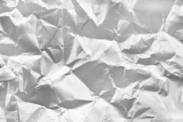 Fototapeta premium Background from crumpled paper in silver color. Paper with scuffs and waves