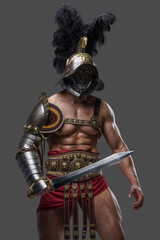 Obraz premium Portrait of combative colosseum warrior with plumed helmet and gladius.