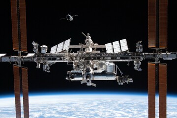International Space Station in orbit. Docking of the Russian spacecraft. Elements of this image furnished by NASA. - Powered by Adobe