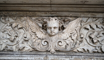 Relief sculpture consisting of a raised surface on a flat background